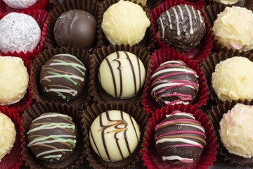 differently decorated white and brown chocolate truffles