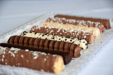 chaocolate candy sticky bars with coconut flakes