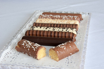 chaocolate candy sticky bars with coconut flakes