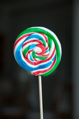 round lollipop on black background