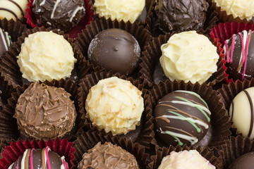 differently decorated white and brown chocolate truffles