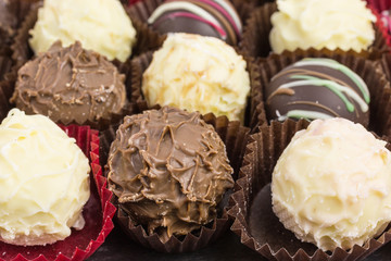 differently decorated white and brown chocolate truffles