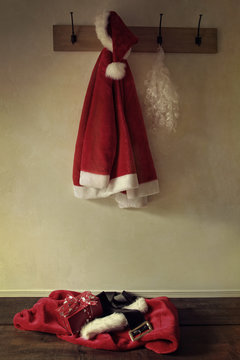 Santa costume hanging on coat rack