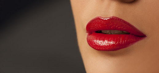 Fototapeta premium beautiful lips with red lipstick