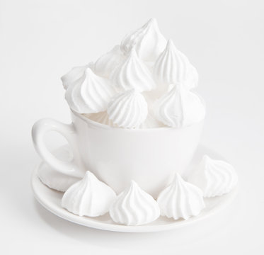white sugar candy meringue in a white cup