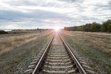 Fototapeta premium Line of the railway. The rails are leaving into the distance. Railroad.