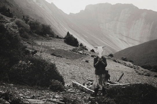 girl holding buffalo skull