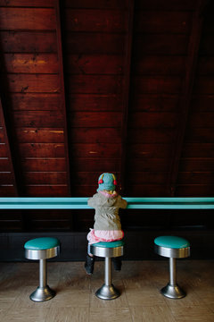girl sitting alone in coffee shop