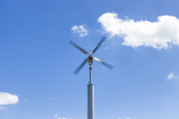 Fototapeta na wymiar the wind turbines againt blue sky