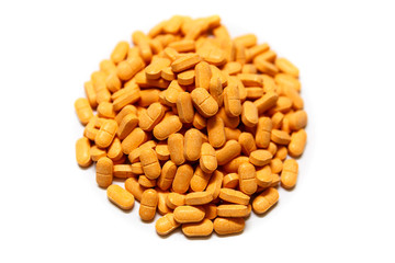 A Pile of Vitamin C Pills, Also Known as Ascorbic Acid, on White Background