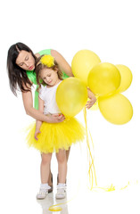 Mom and daughter with colorful balloons.
