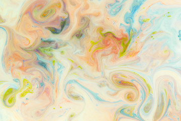 Fototapeta na wymiar Artistic abstract design created with mixing color liquids. Colorful background texture. Liquids mixing on water surface