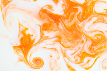 Artistic abstract design created with mixing color liquids. Colorful background texture. Liquids mixing on water surface