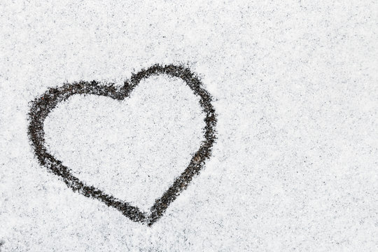 heart drawn in snow winter forest nature