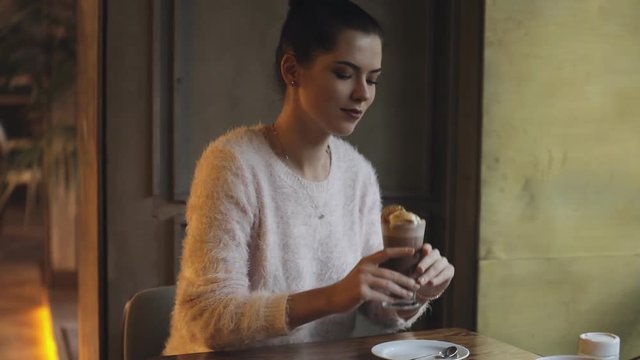 Woman ready to drink cacao in coffee shop