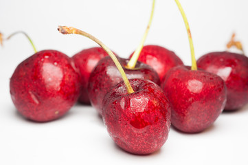Ripe cherry in closeup on white background.