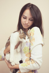 Beautiful girl hugging a cat