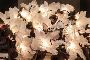 burning night light made of nylon flowers