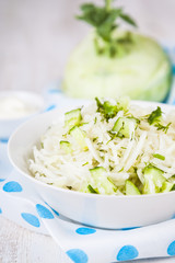 Salad with kohlrabi, cucumber and dill.