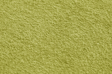 Fototapeta premium Yellow color towel surface close-up with blur effect.