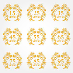 Anniversary icon set in ornate frame with floral elements. Template for celebration and congratulation design. 15,25,35,45,55,65,75,85,95th anniversary golden label. Vector illustration.