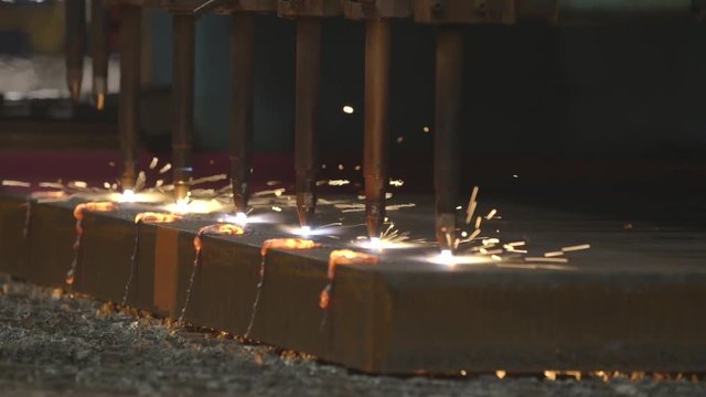 Multiple autogenous cutters cutting steel
