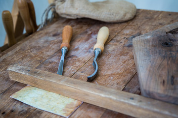 Chisel and Cutting Wood Equipment on Wooden Plank