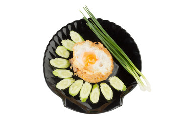 Fried rice pork with fried Egg on dish black. cucumber.Spring onion on isolated on white background