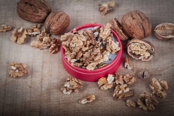 Walnuts (Juglans regia) on a wooden table