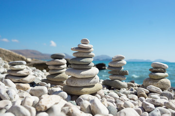 Pyramid of pebbles on a sea beach.