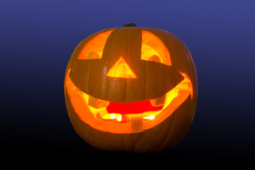 Halloween pumpkin glowing in the dark