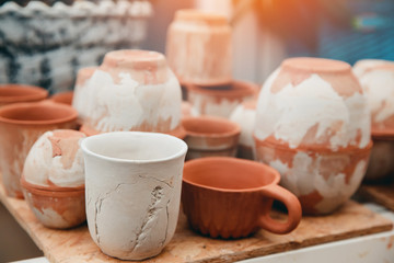 Ceramics. Master sculpts makes a plate according to the mold