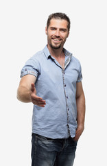 Fototapeta premium stylish young man holds out his hand for a handshake.