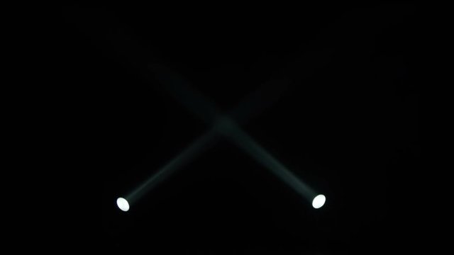 Realistic footage of stage light flashing rays spotlights through smoke. Great as a natural stage background for different projects!!!