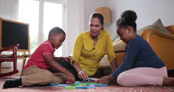 Mum with Kids building a tower