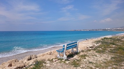 Fototapeta na wymiar Bench on the shore of the Mediterranean Sea (Cyprus) 
