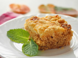 Piece of crumble pie. Homemade biscuit decorated with crumbs. Selective focus
