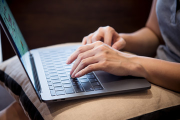 Hands of women working with laptop