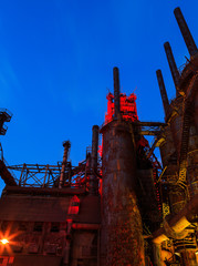 Industrial steel stacks rusted and colorful over time in Bethlehem Pa on a summer day.