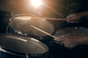The man is playing drum set.