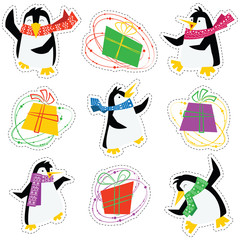 Obraz premium Dancing xmas penguins in a bright scarves and colorful gift boxes stickers set.