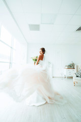 beautiful bride in a luxurious dress in eco-style