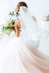 beautiful bride in a luxurious dress in eco-style