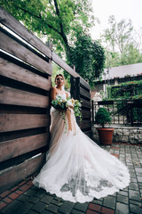 Fototapeta premium beautiful bride in a luxurious dress in eco-style