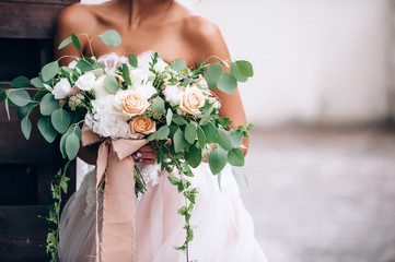 beautiful bride in a luxurious dress in eco-style
