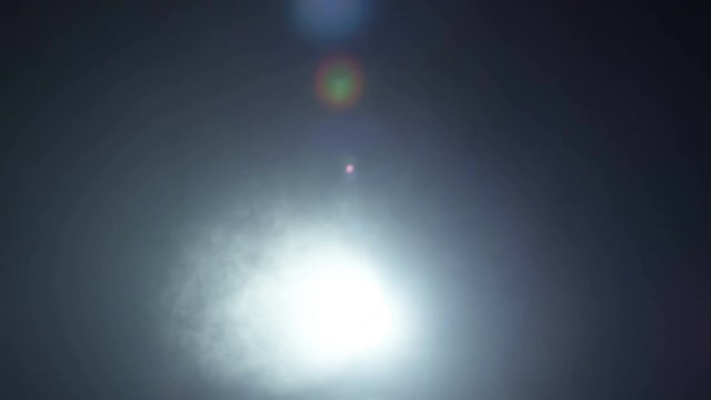 Realistic footage of stage light flashing rays spotlights through smoke. Great as a natural stage background for different projects!!!