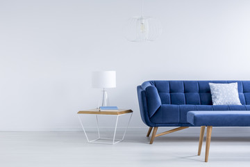 Bedside table next to sofa