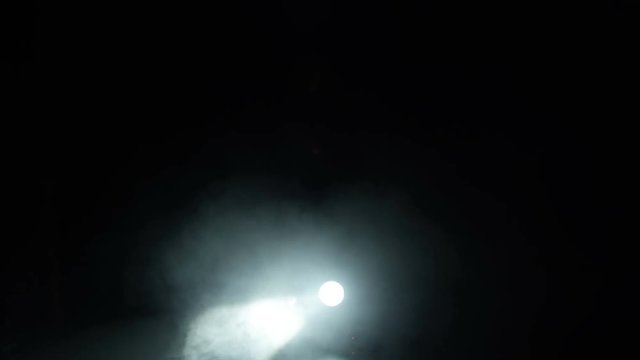 Realistic footage of stage light flashing rays spotlights through smoke. Great as a natural stage background for different projects!!!