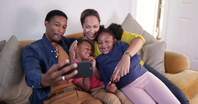 Family taking a selfie with a smartphone