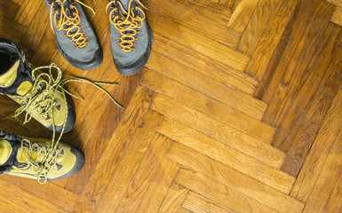 Mountain boots on the parquet.